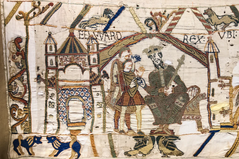A scene from the Bayeux tapestry showing Edward the Confessor in his turreted palace.