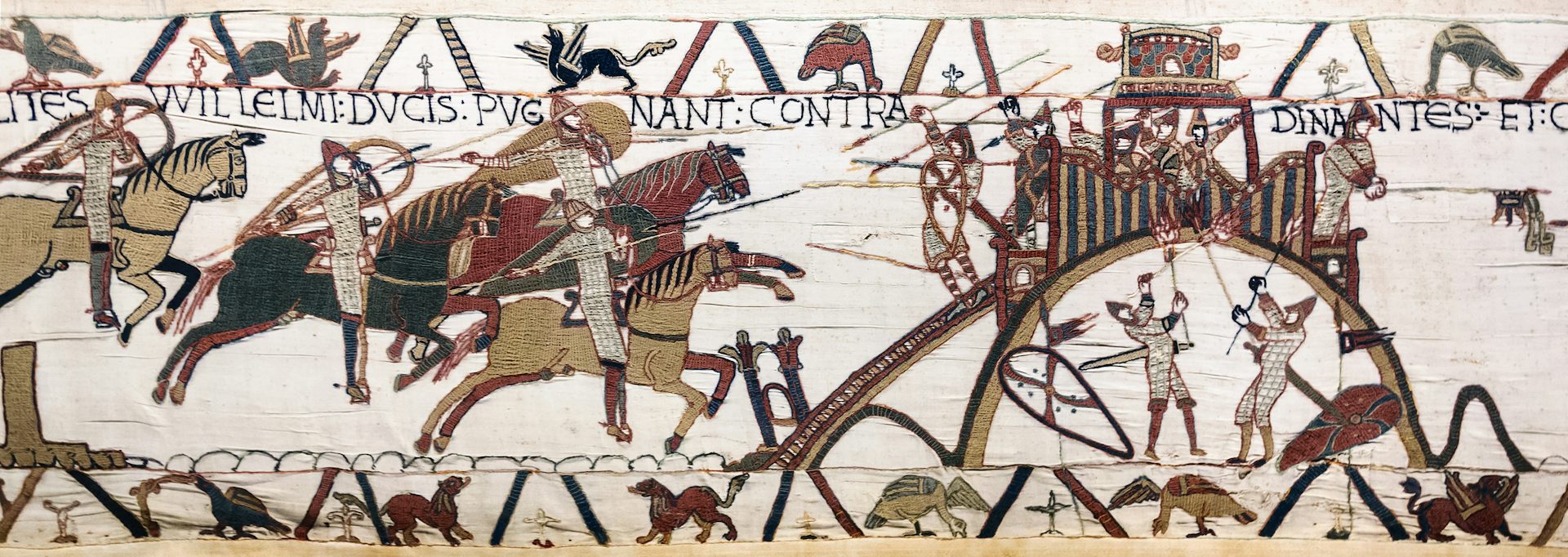 An embroidered image of the 11th century motte and bailey castle at Dinan in France on the Bayeux tapestry.
