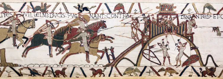 An embroidered image of the 11th century motte and bailey castle at Dinan in France on the Bayeux tapestry.