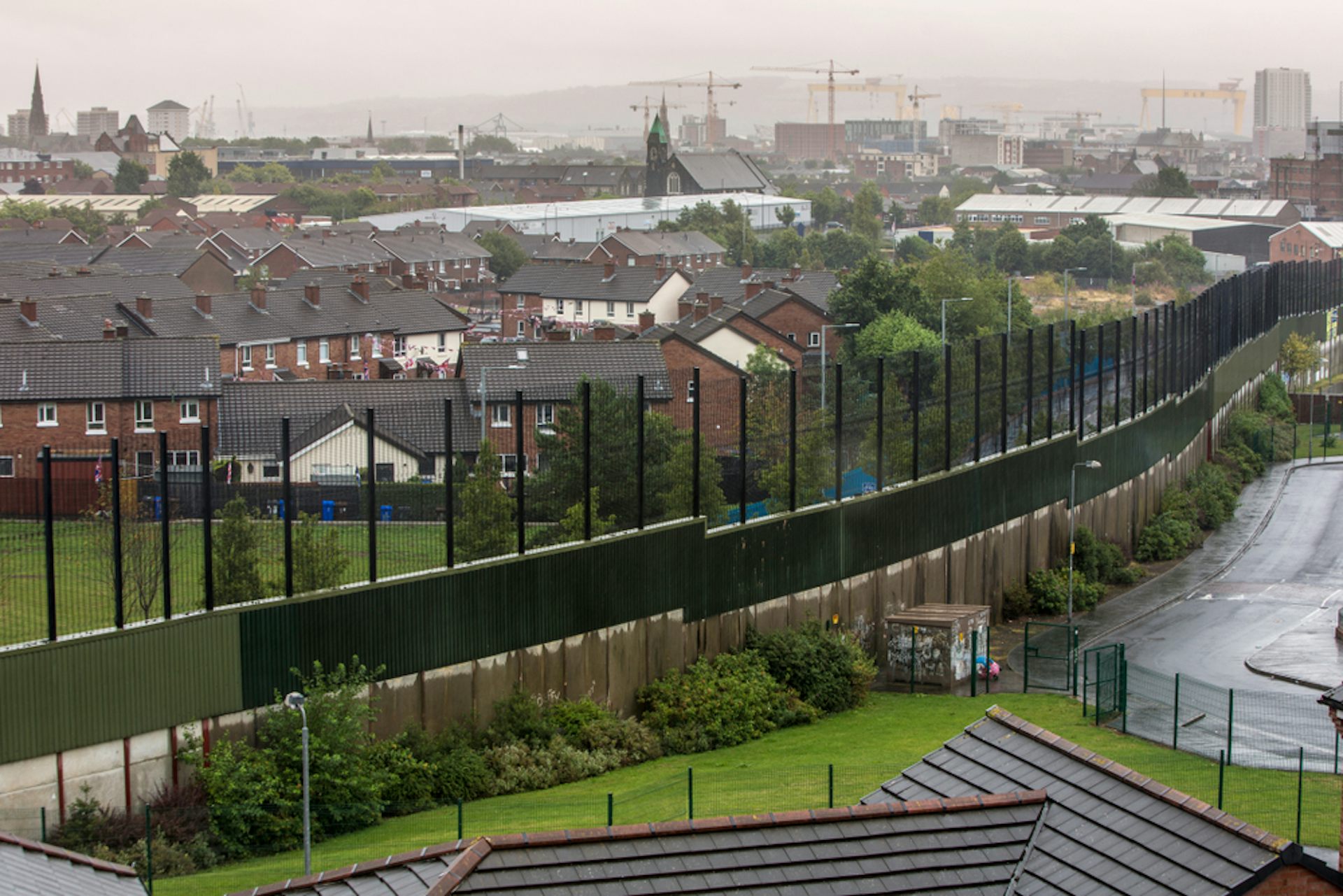A photograph of a dividing fence in Belfast.