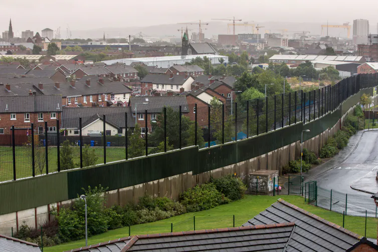 A photograph of a dividing fence in Belfast.
