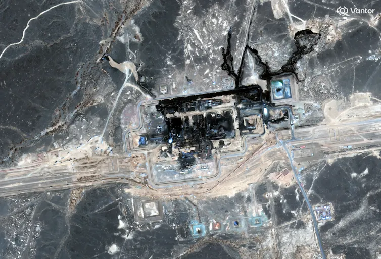 Fire damage and extensive blackened areas in and around the East-West pipeline pumping station in Saudi Arabia, following a drone attack.