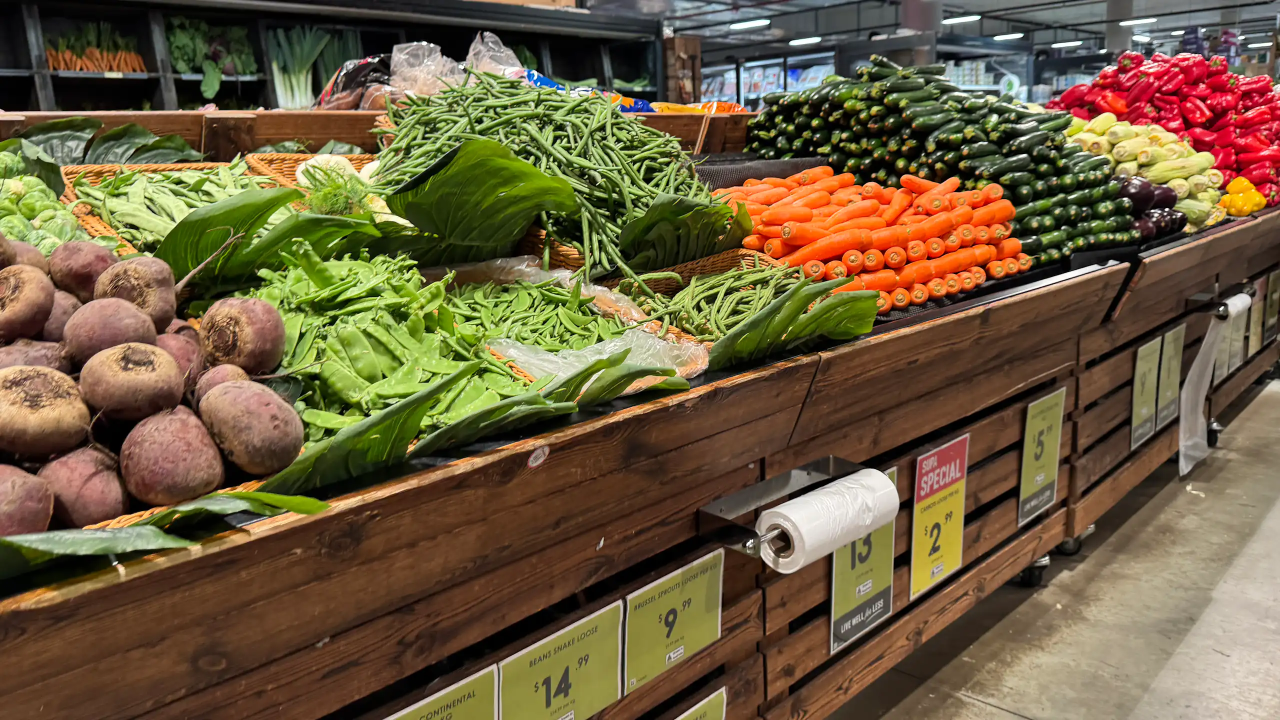 produce is seen in the fruit and vegetables section of a supermarket