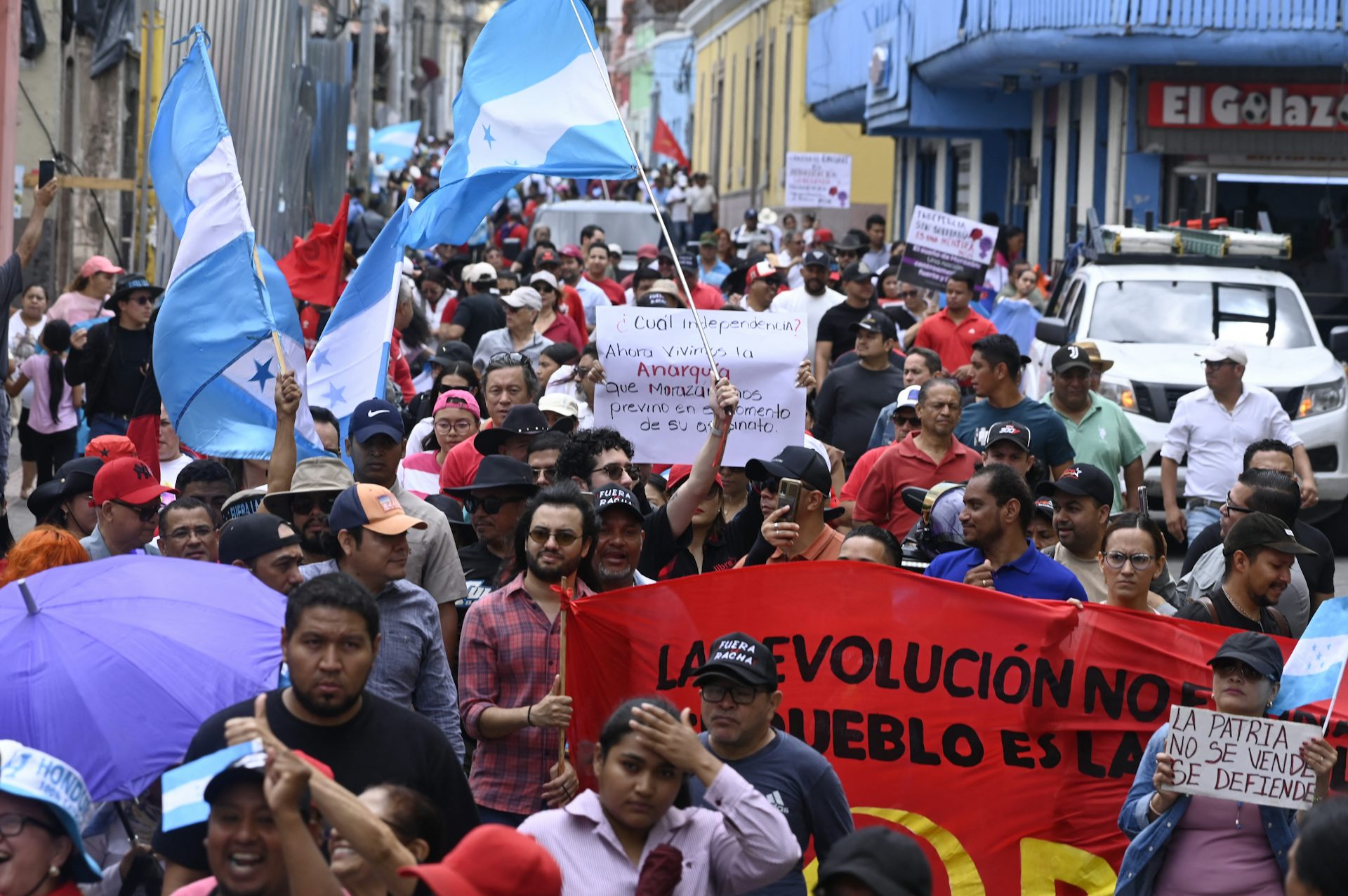 Demonstrators rally in a public square.