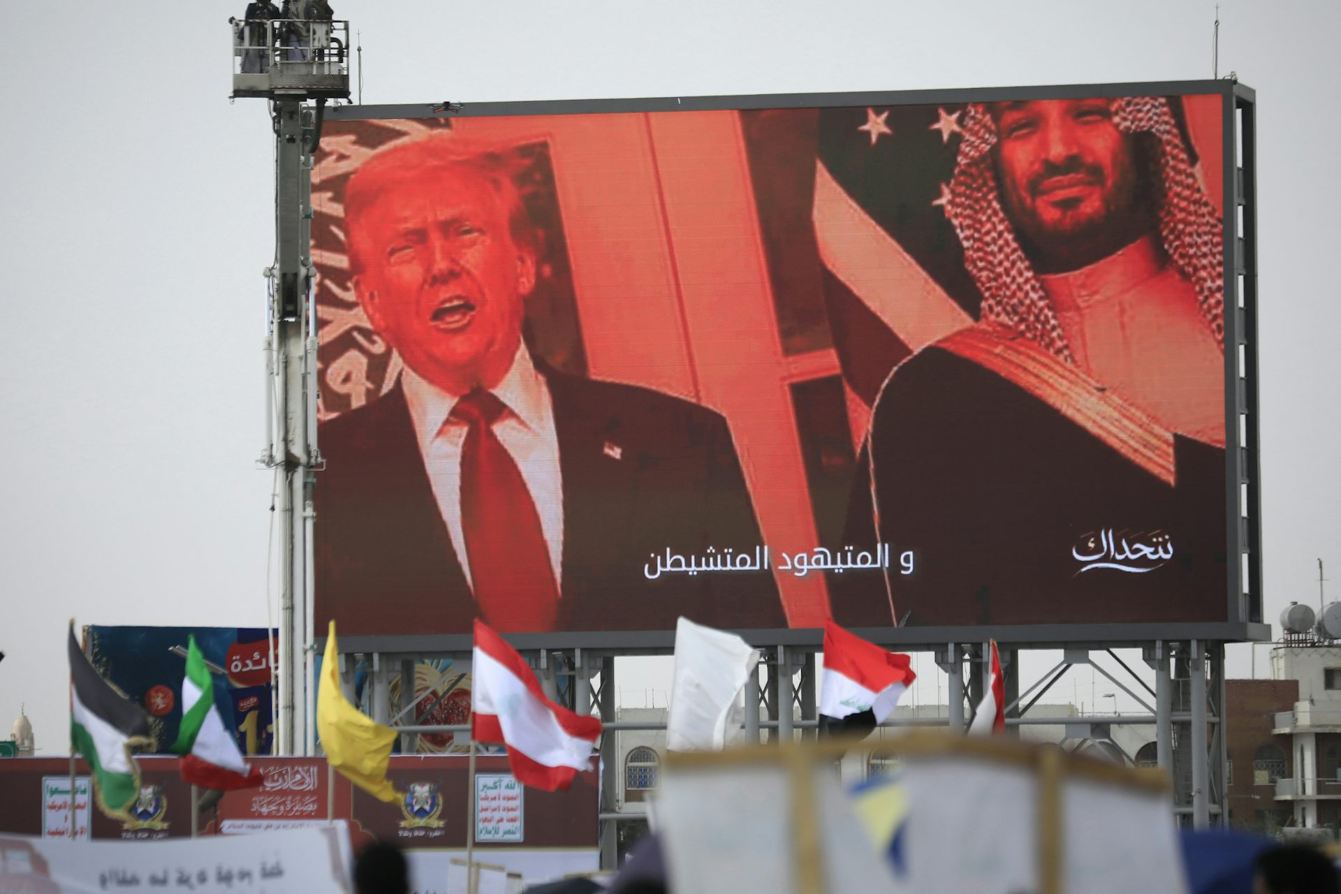 US president, Donald Trump,  and Saudi crown prince, Mohammed bin Salman displayed on a digital billboard at a pro-Iran protest in the Yemen capital Sana'a