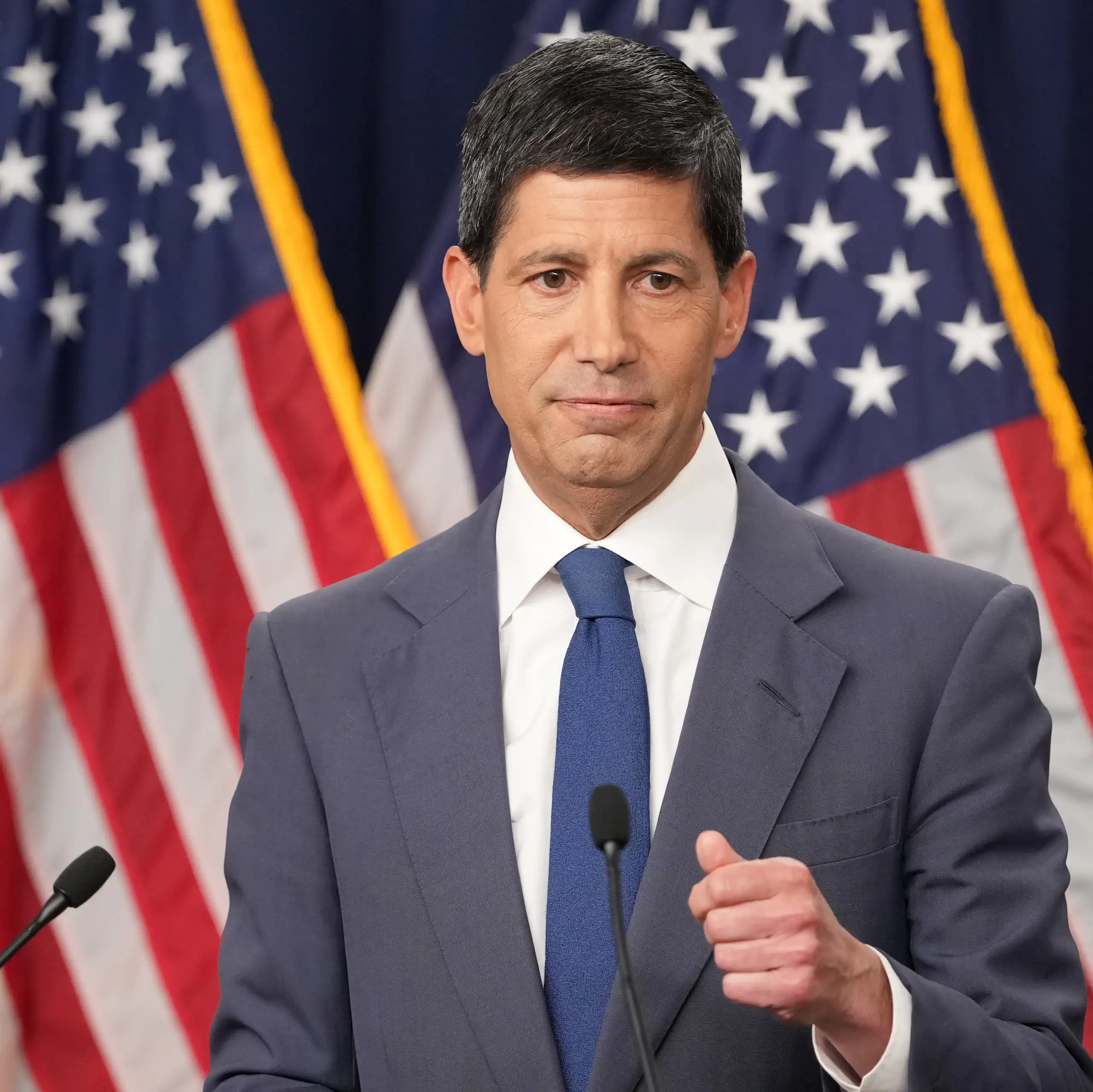Federal Reserve Chair Kevin Warsh, wearing a grey suit and a blue tie, speaks at a news conference in Washington on July 29, 2026.