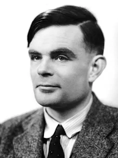 Headshot of a man wearing a suit and tie.