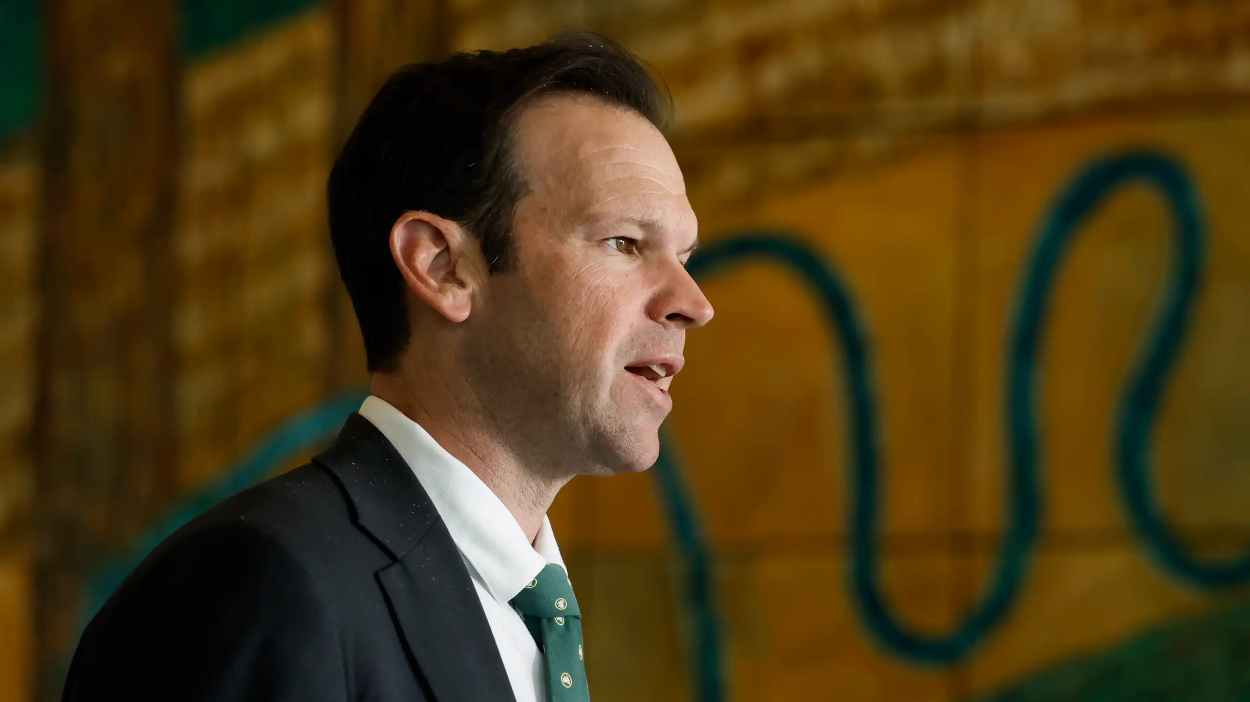 A side profile of Nationals leader Matt Canavan speaking to the media