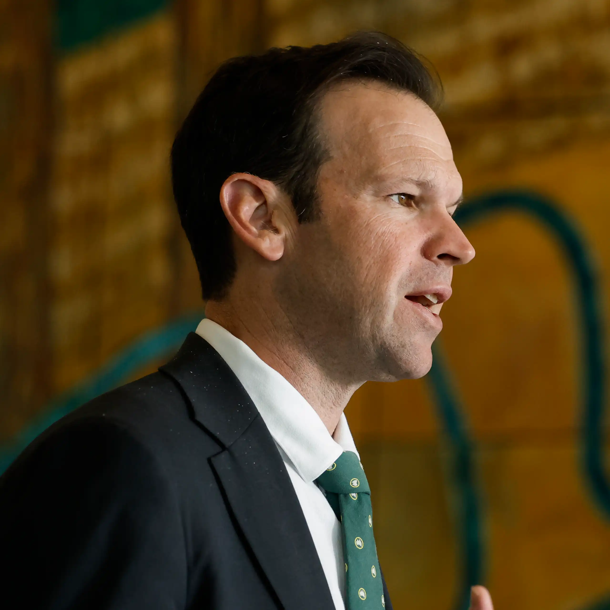A side profile of Nationals leader Matt Canavan speaking to the media