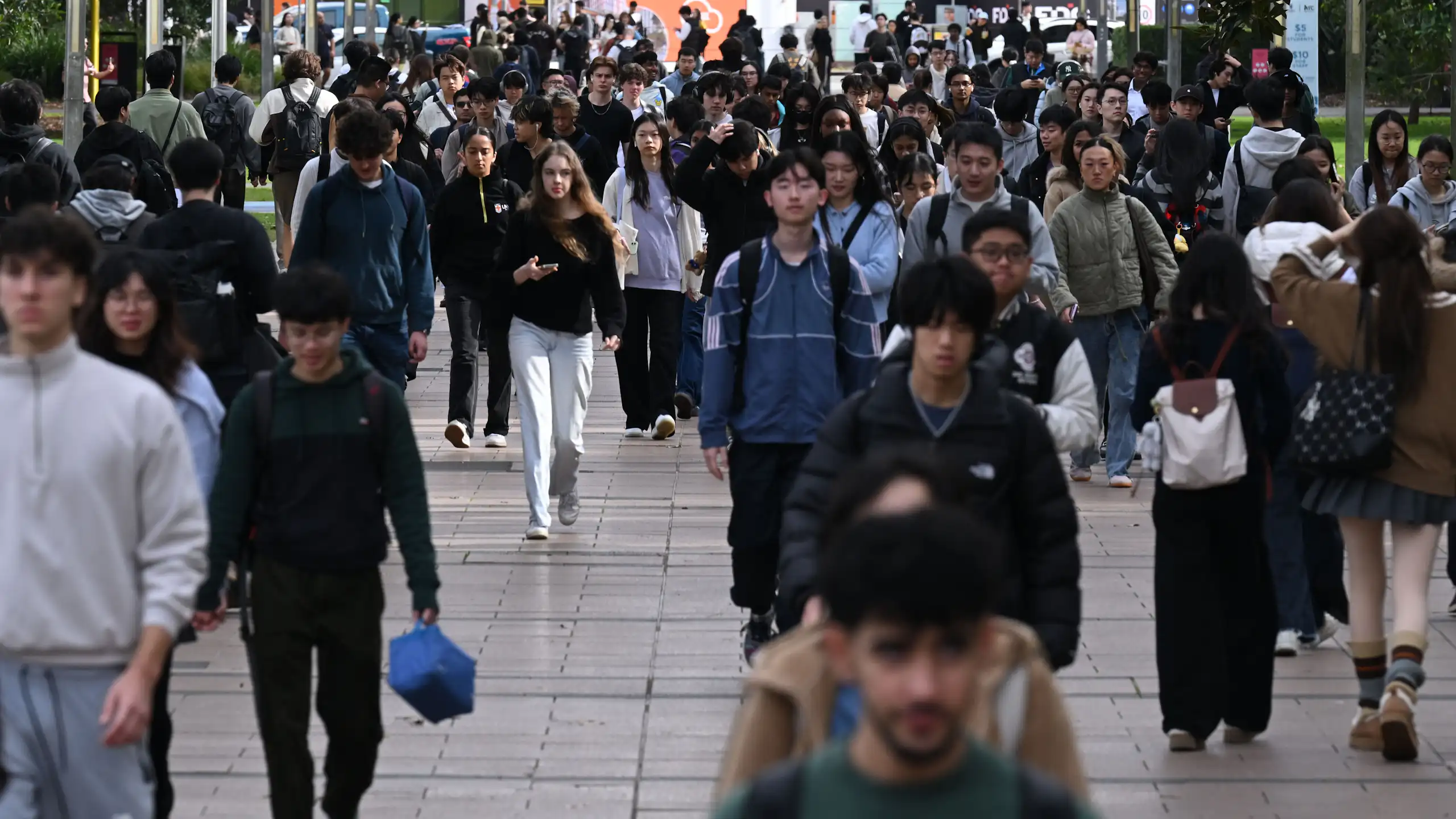 A crowd of university students walking to and from classes at the University of New South Wales.