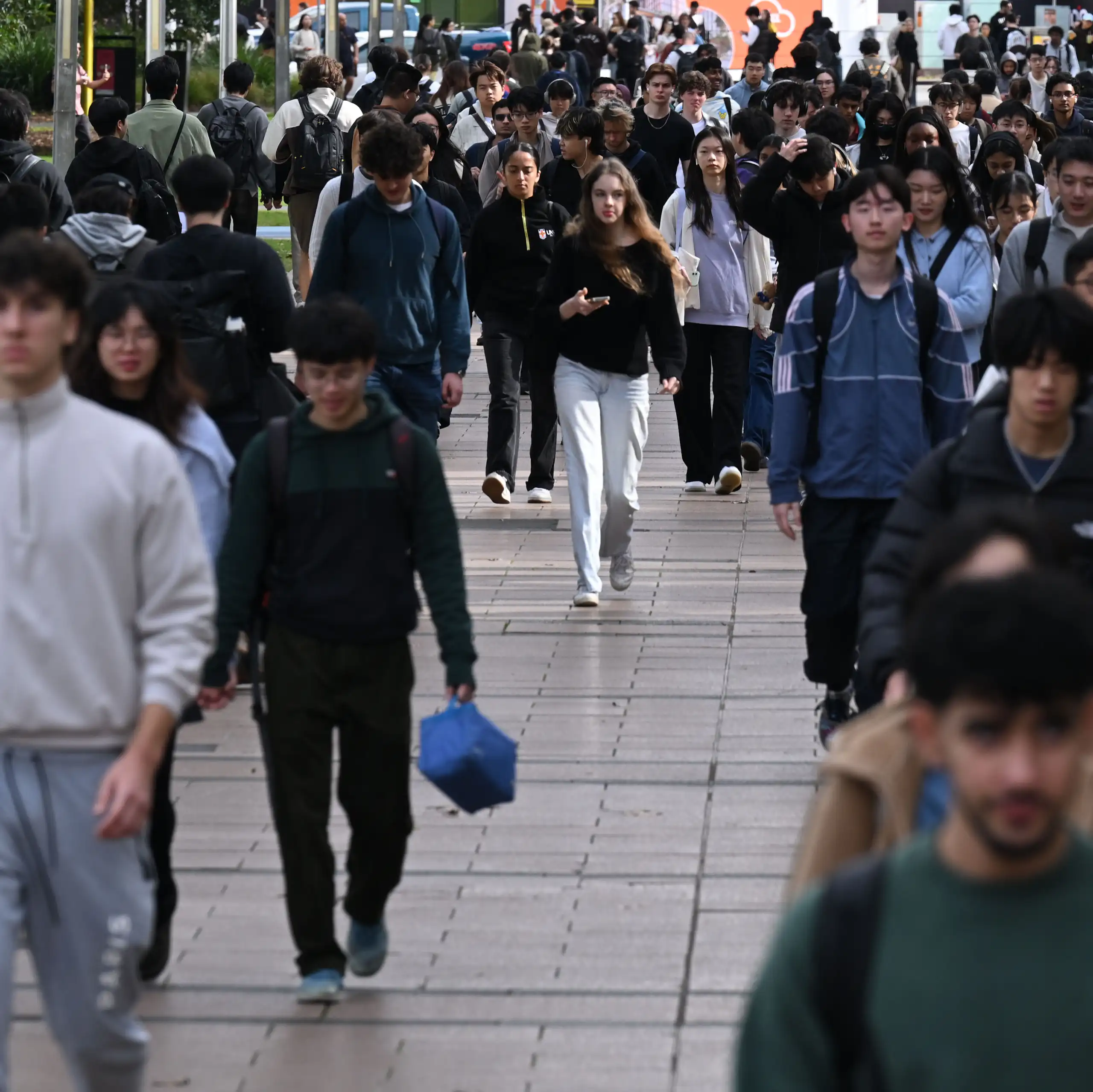 A crowd of university students walking to and from classes at the University of New South Wales.