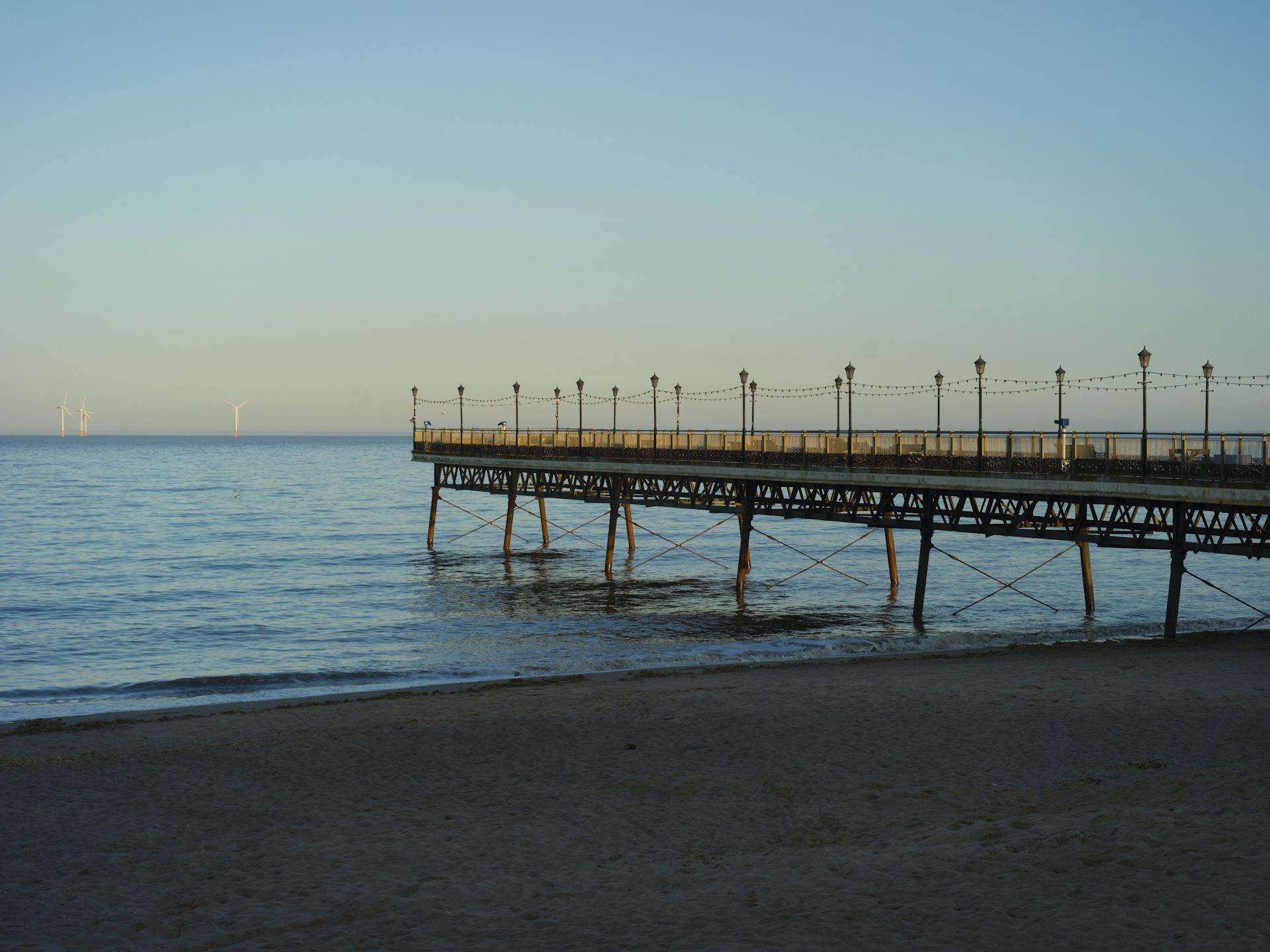 A pier on a calm sea.