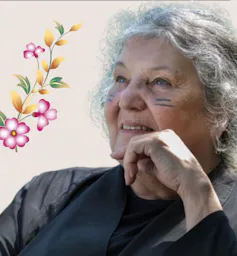 Image of a woman surrounded by floral desigh.
