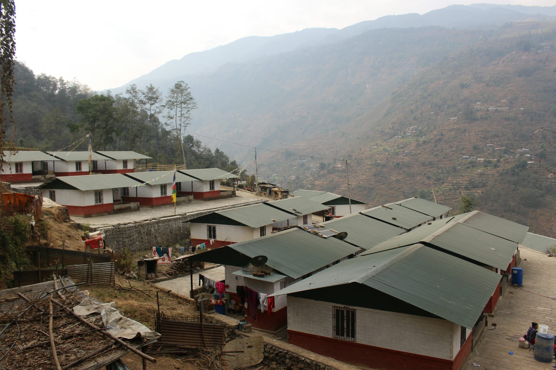 A new settlement of houses with hills in the background.