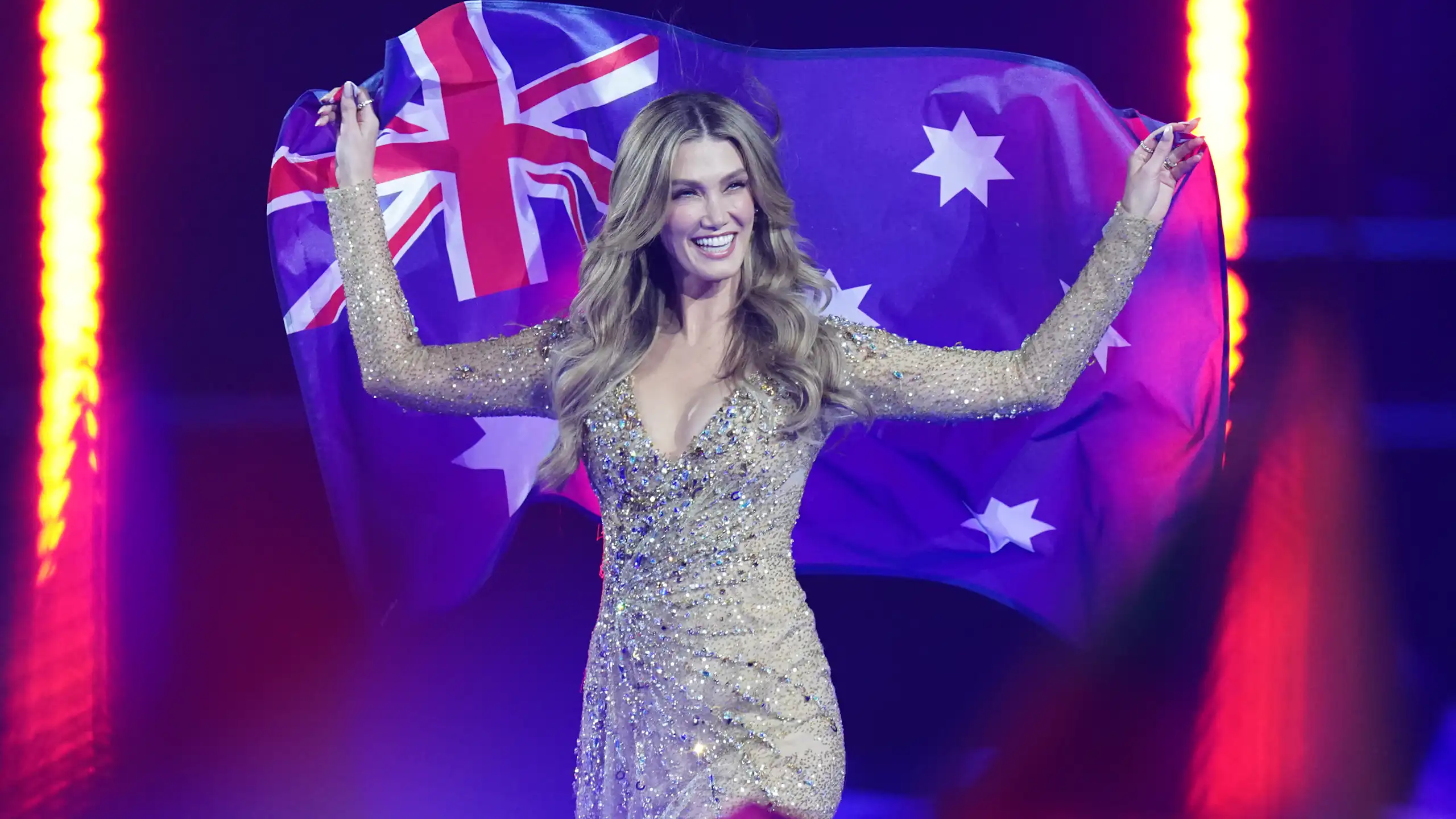 Delta Goodrem holds an Australia flag at Eurovision