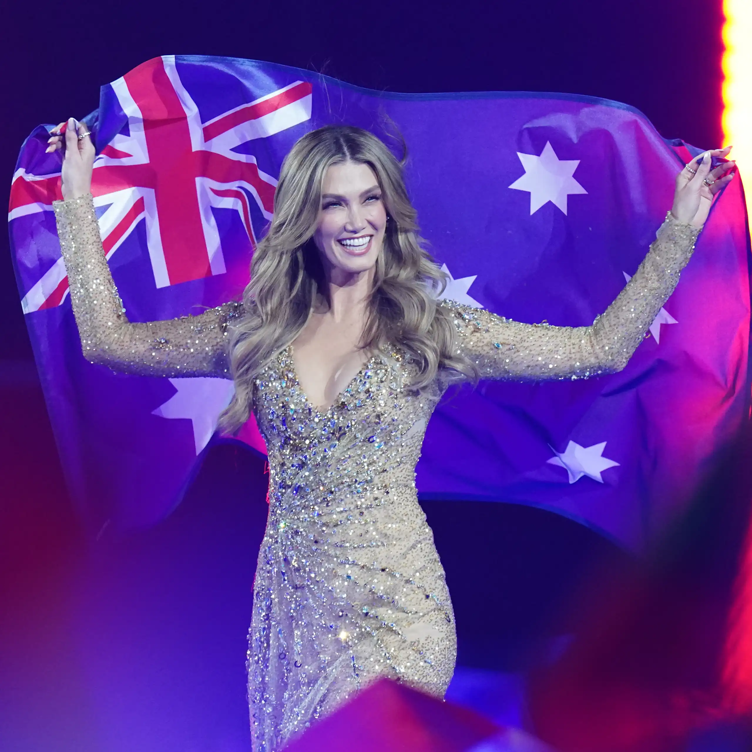 Delta Goodrem holds an Australia flag at Eurovision