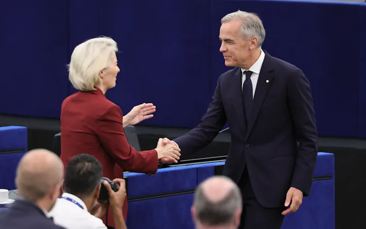 Mark Carney shakes hands with Ursula von der Leyen at the European Parliament.