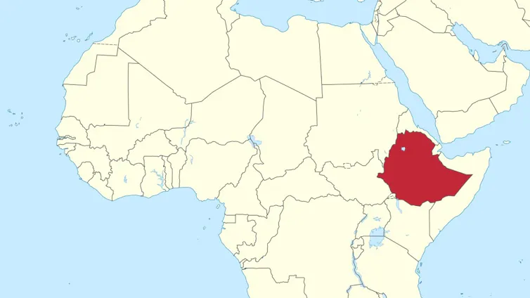 A light yellow map of Africa with a blue sea and blue national border lines, Ethiopia highlighted in red.