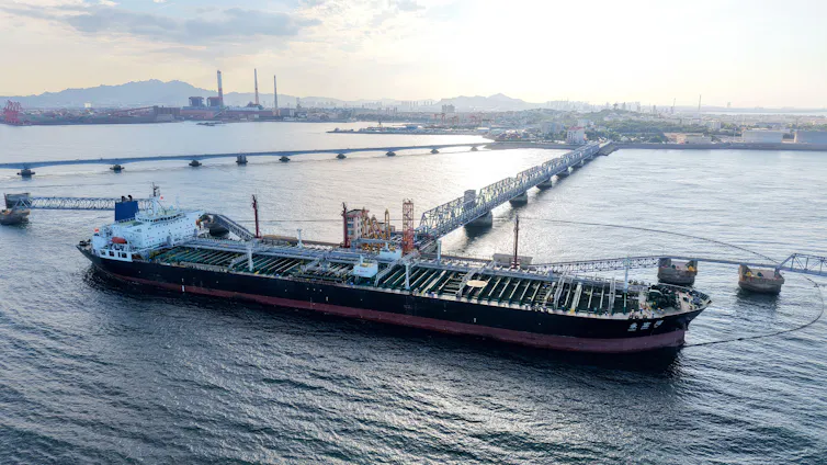 oil tanker berthed at port in China.