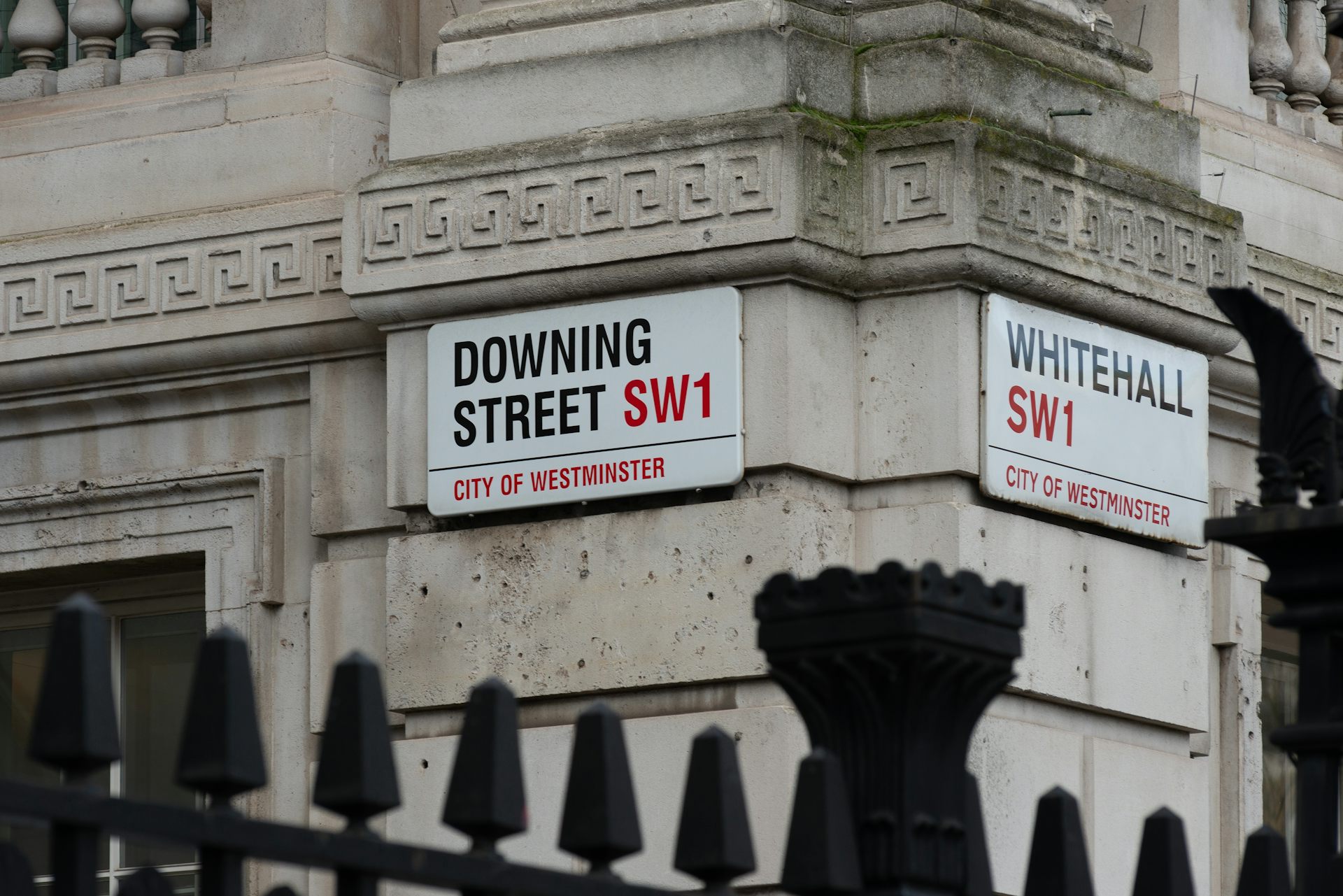 Street signs for Downing Street and Whitehall.