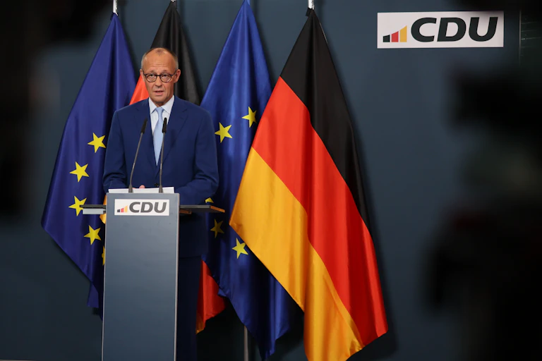 Friedrich Merz looks dejected as he addresses the media following regional election defeats.