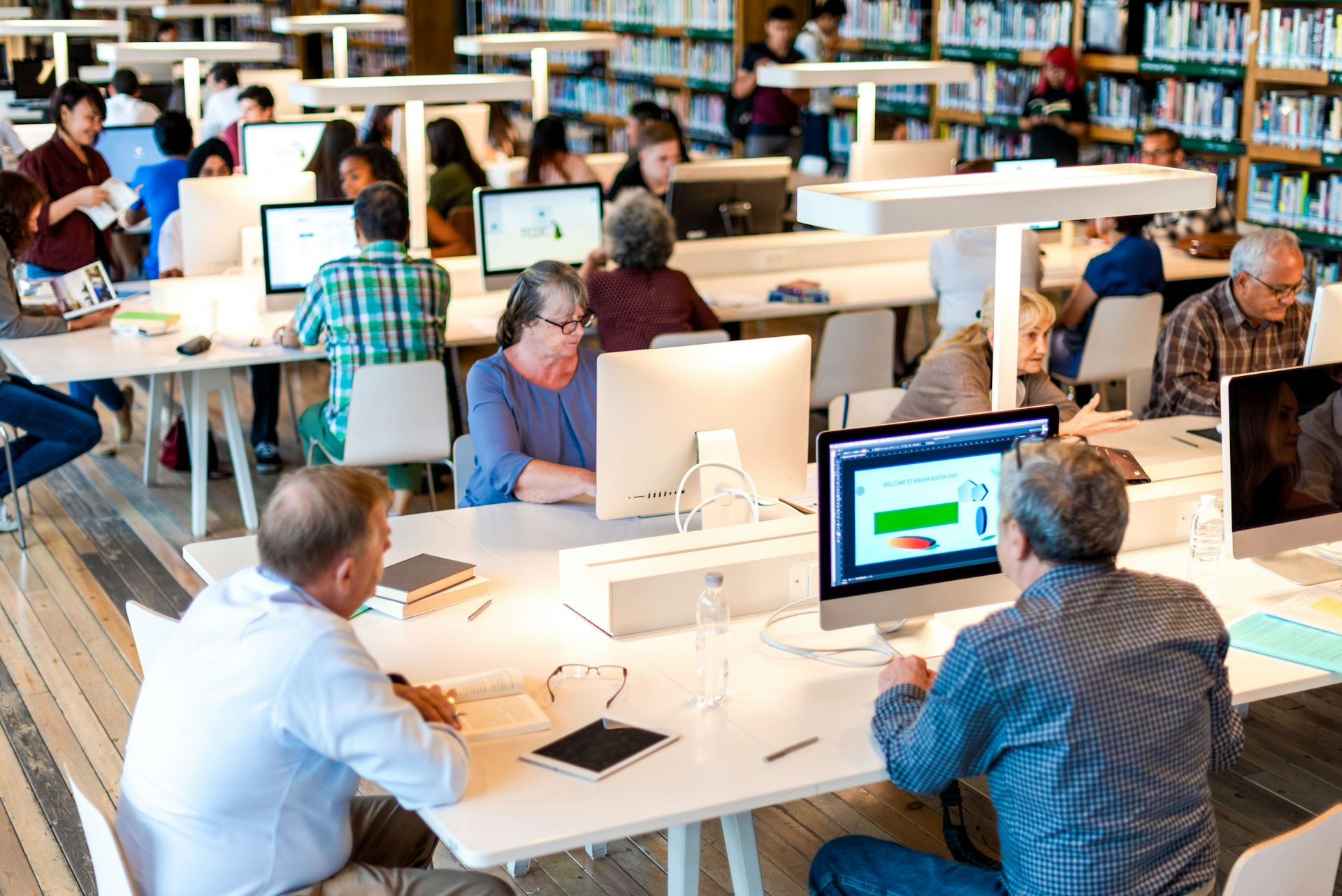 People using computers in a public library