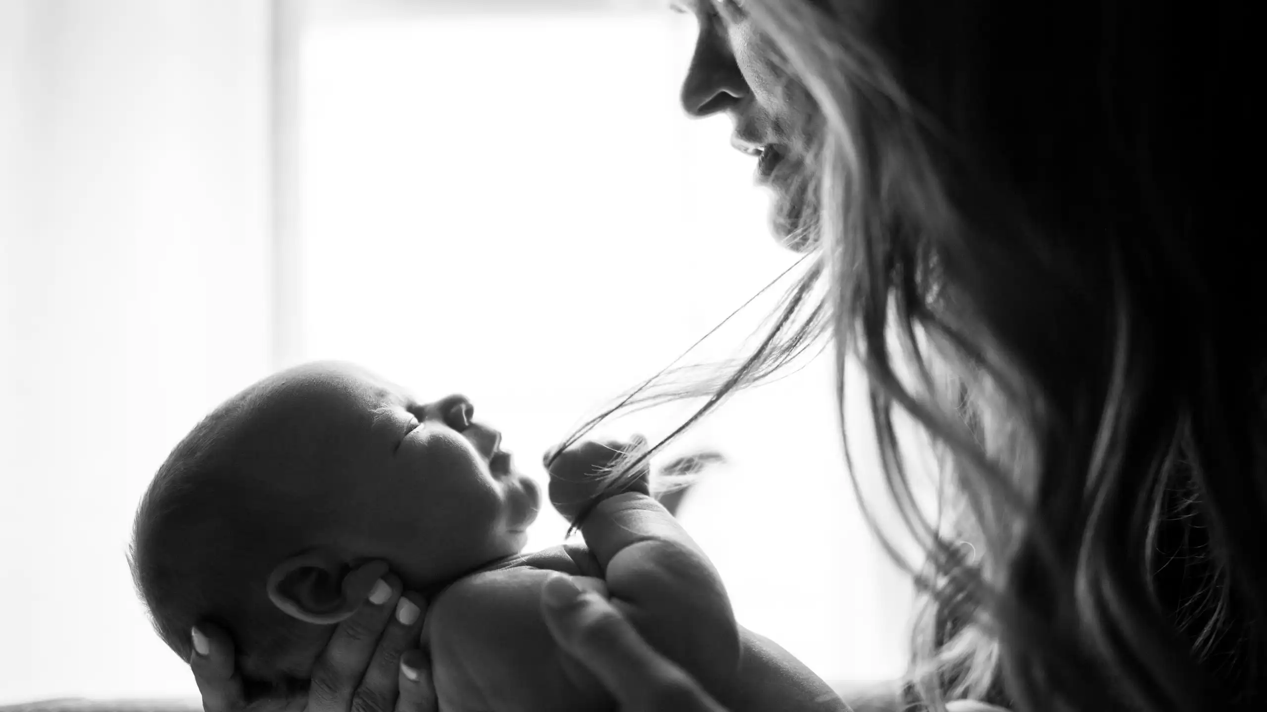 A close-up of a woman holding a baby.
