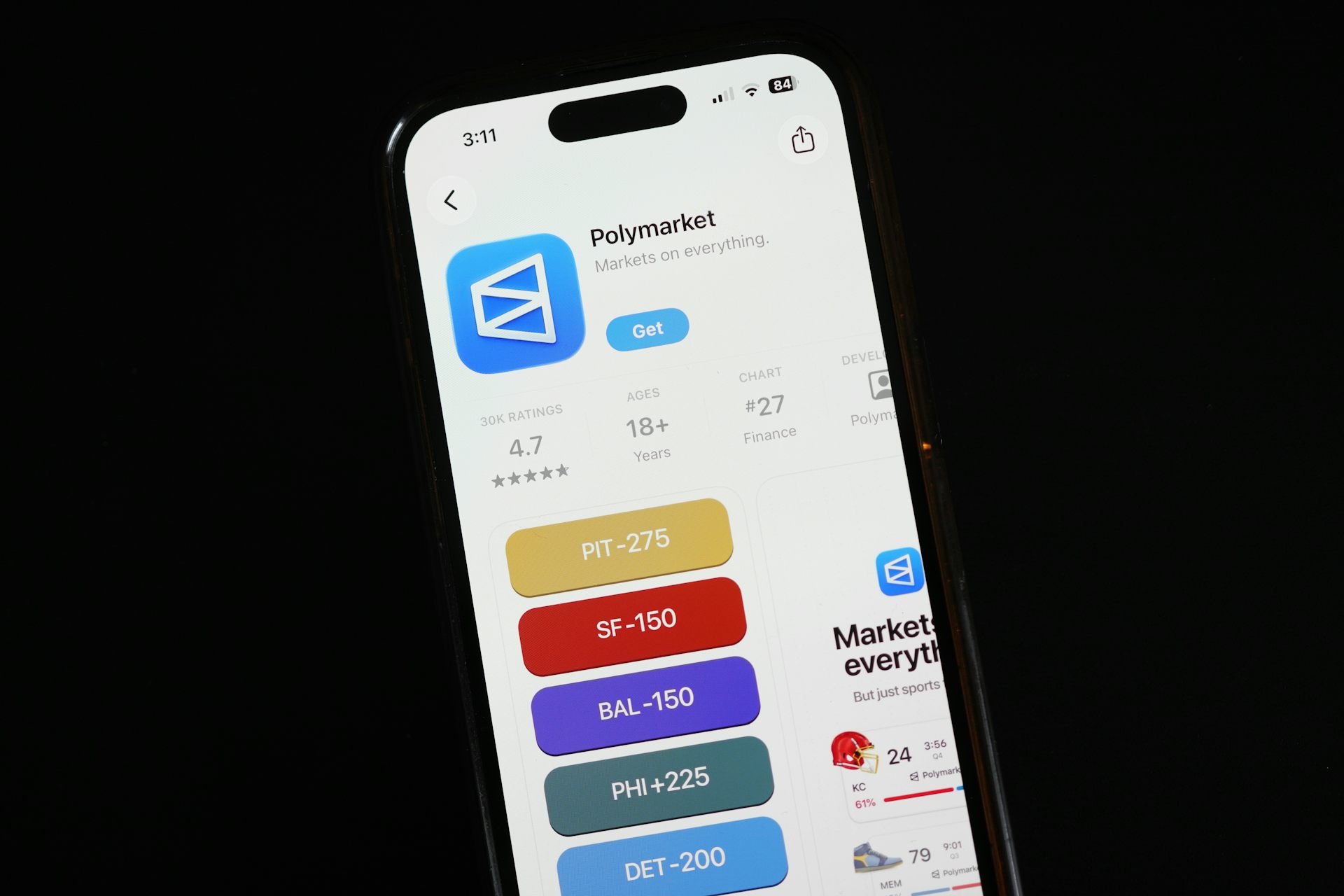 The prediction market app Polymarket is displayed on a mobile phone