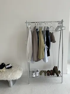 A capsule wardrobe on a clothes rail