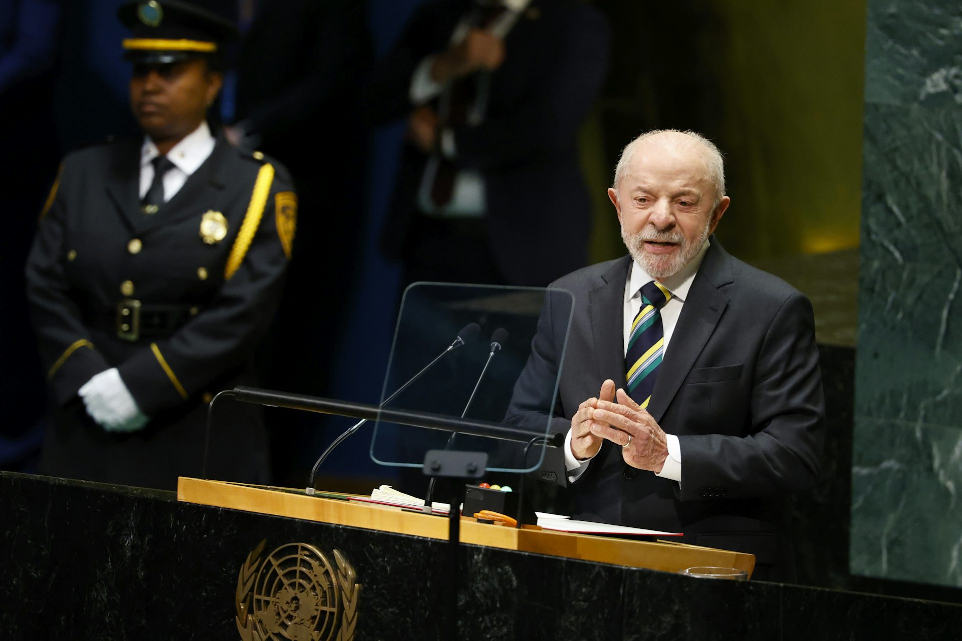 A man speaks at a podium.