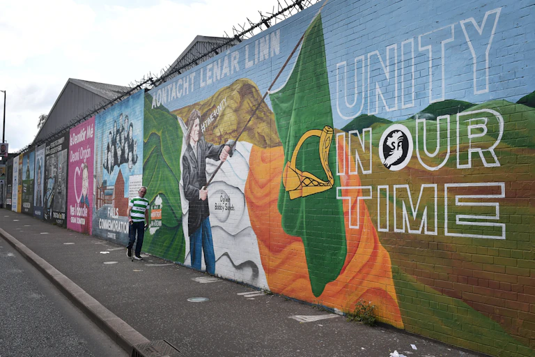A large mural has the words 'Unity in our Time' written on it.