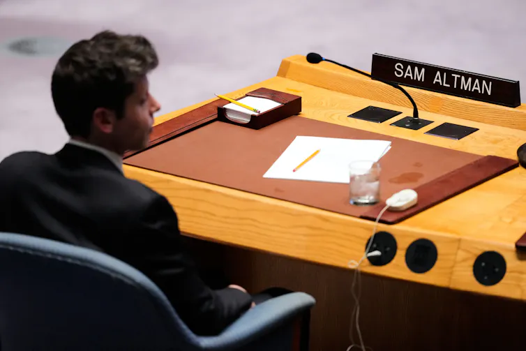 Sam Altman sits at the U.N. Security Council table behind a nameplate bearing his name.