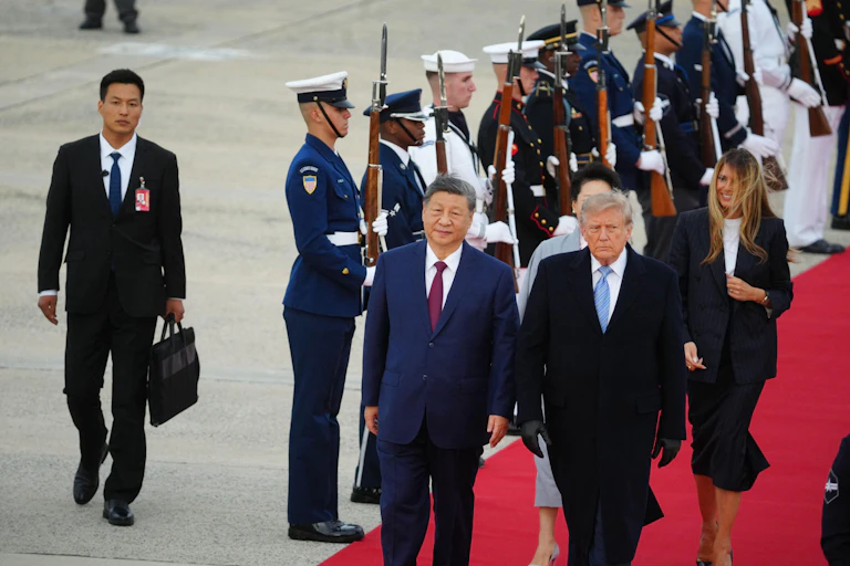 US president Donald Trump andChina's president, Xi Jinping walk along a red carpet at Joint Base Andrews in Maryland, September 23 flanked by a military honour guard.