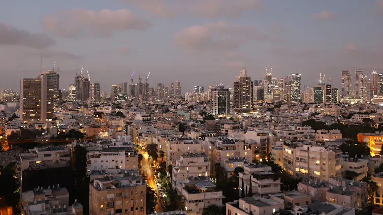 A city skyline at dusk.