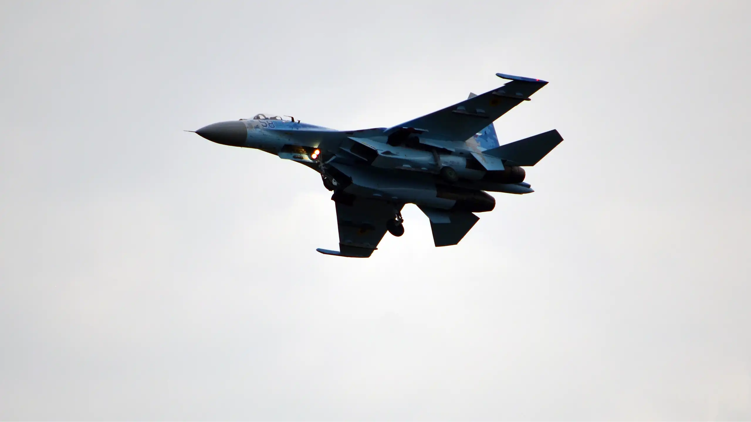 A fighter jet belonging to the Ukrainian Air Force flies through the sky.