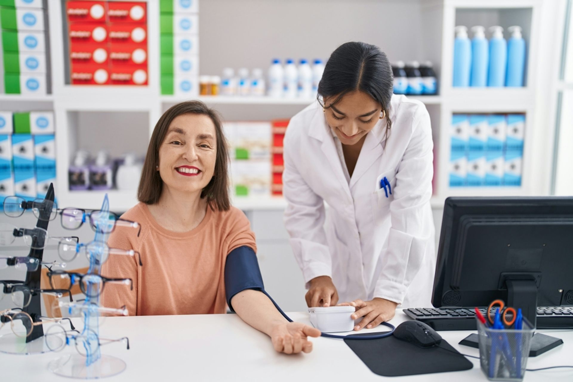 A woman having her blood pressure checked at a pharmacy.
