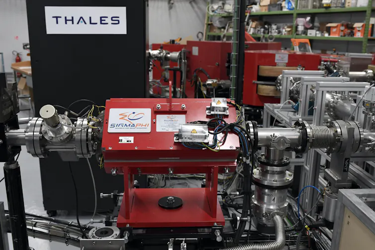 A large piece of machinery, with tubes coming out of it, in a lab workspace