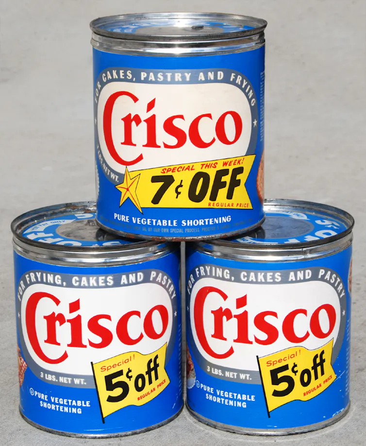 A stack of three cans labeled 'Crisco.'