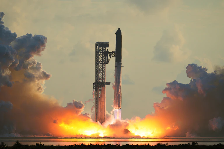 A rocket lifting off from a launchpad, with a plume of flame and smoke beneath it.