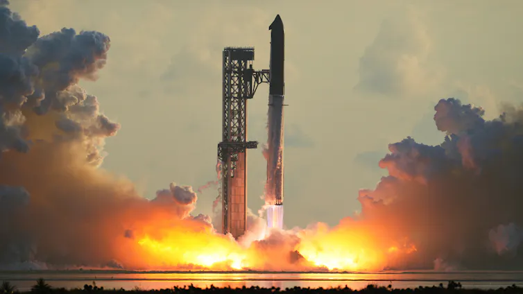 A rocket lifting off from a launchpad, with a plume of flame and smoke beneath it.