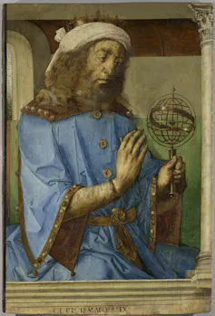 A portrait of a bearded man holding a small globe.