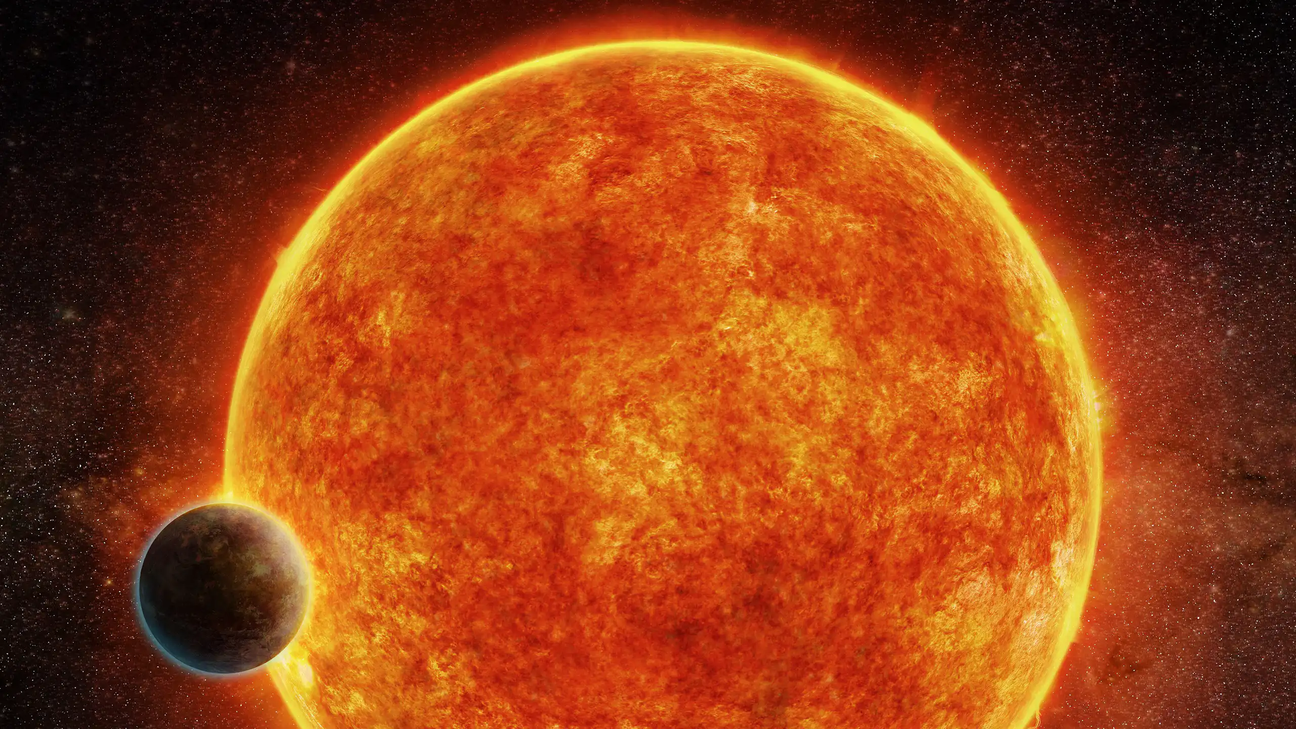 A large planet that looks like an orange fiery ball with a yellow rim, and a small planet in front.