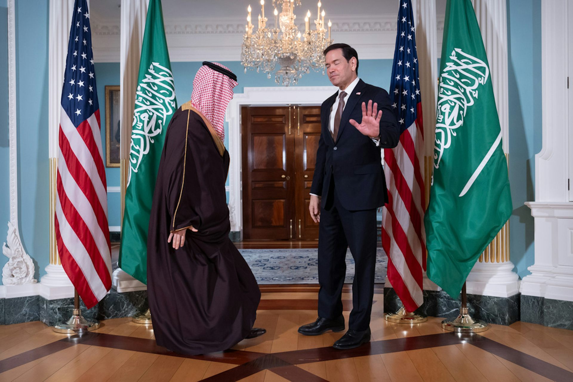 Two men gather a diplomatic meeting.