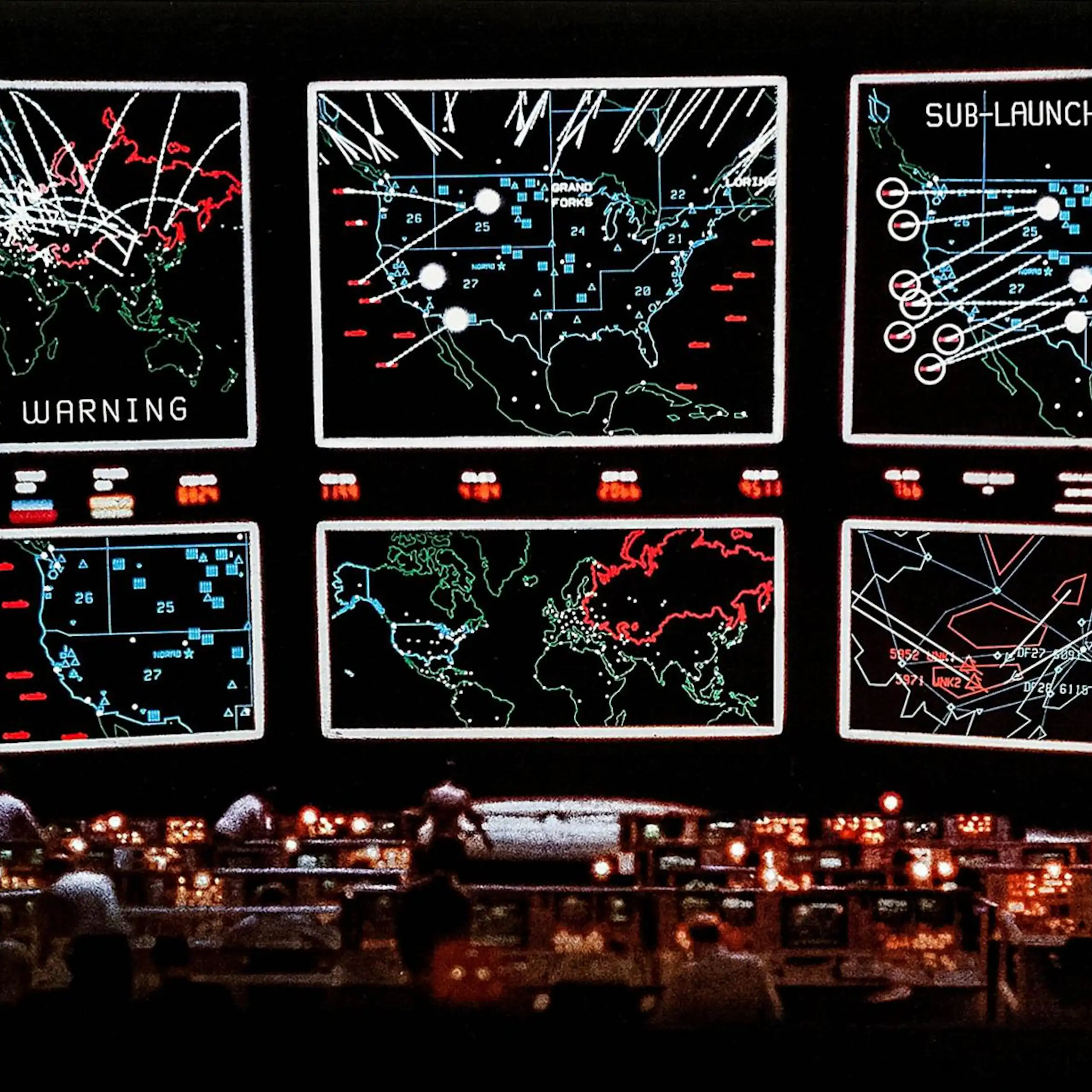 a dark room with a set of very large display screens