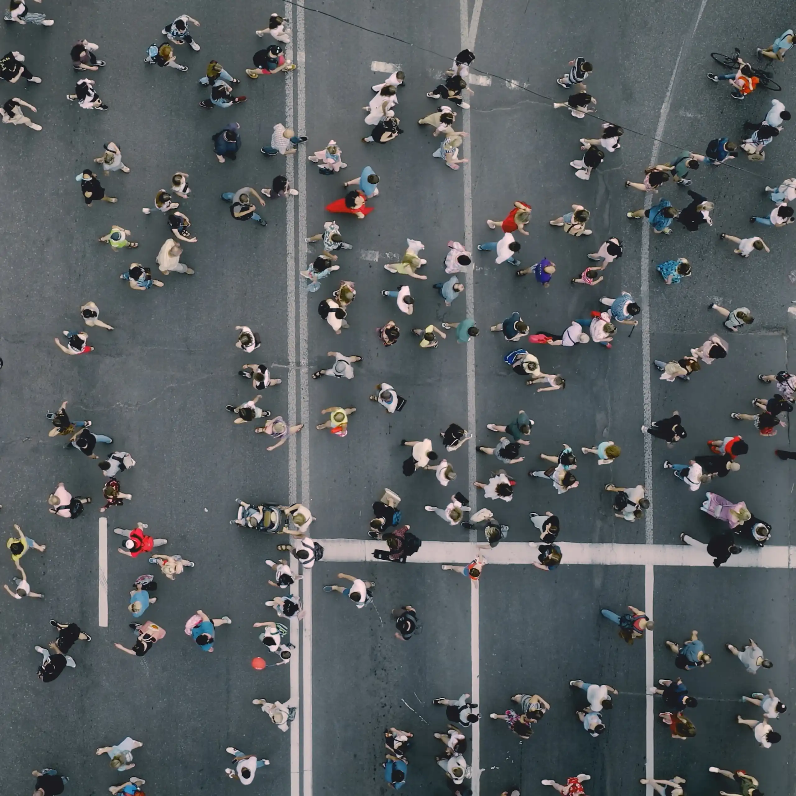 Pedestrians are crossing the road from one side to the other