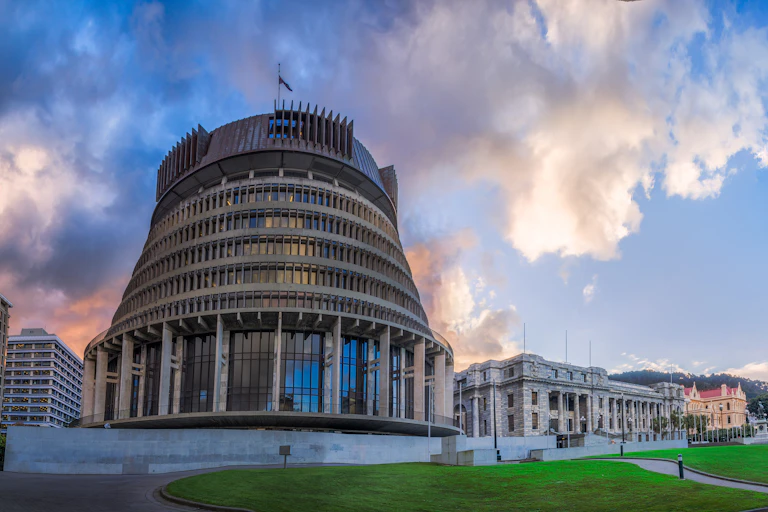 Beehive government and parliament buildings under clouds