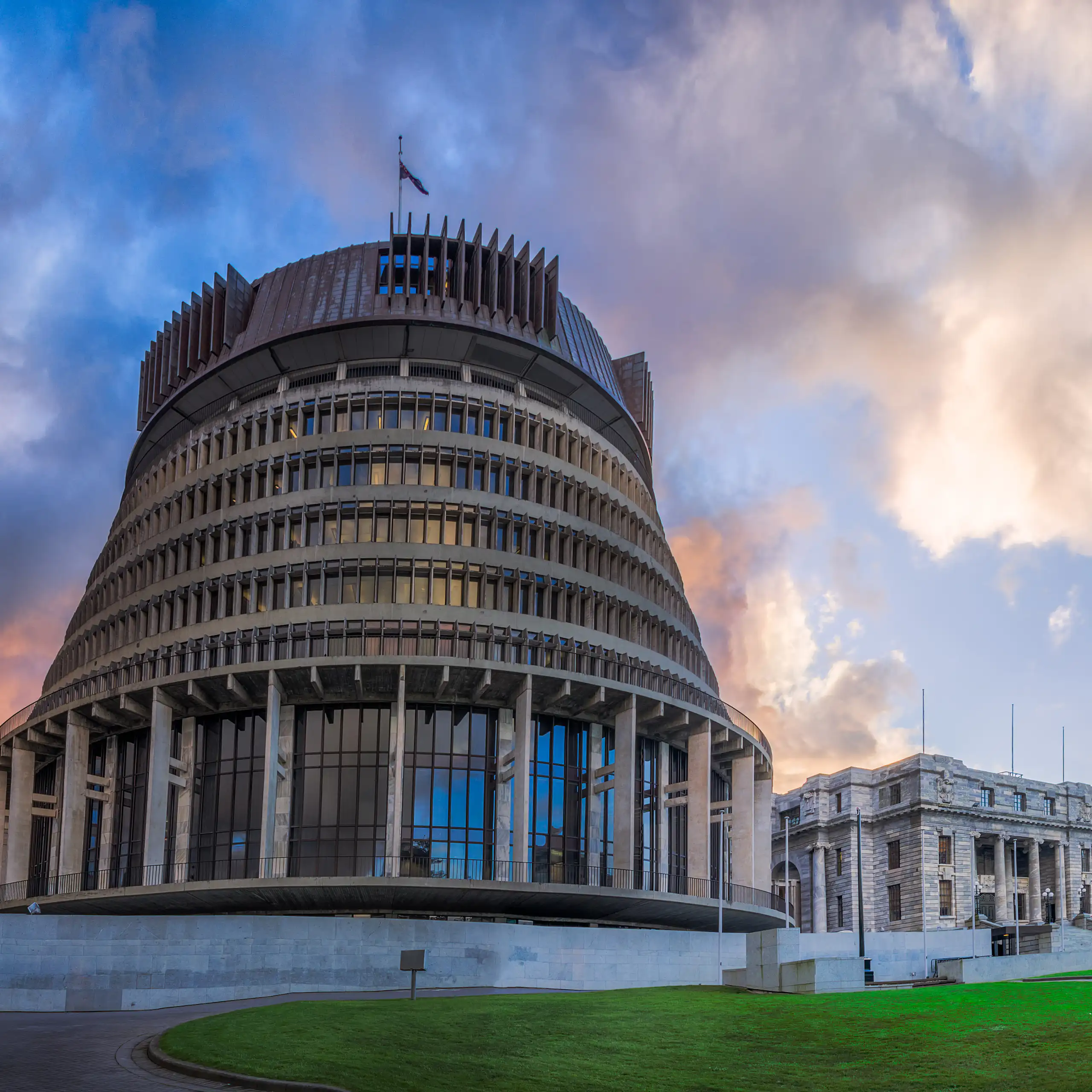 Beehive government and parliament buildings under clouds