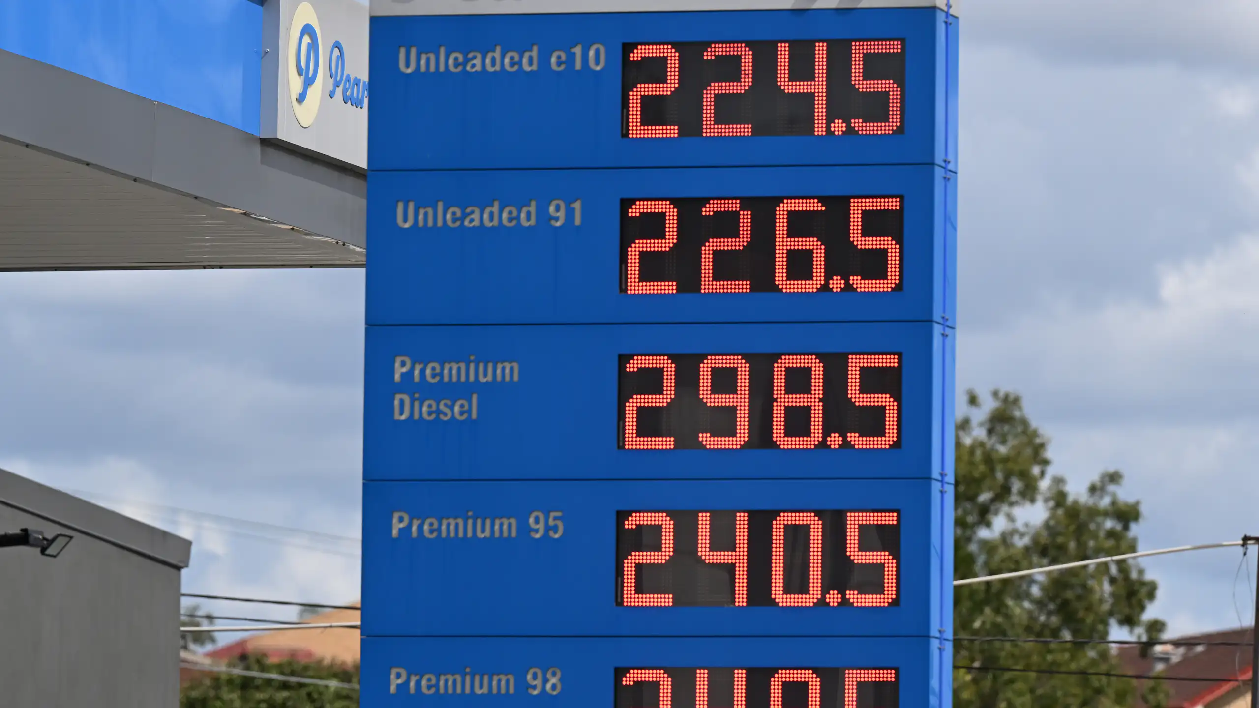 Signage showing fuel prices at a petrol station in Brisbane