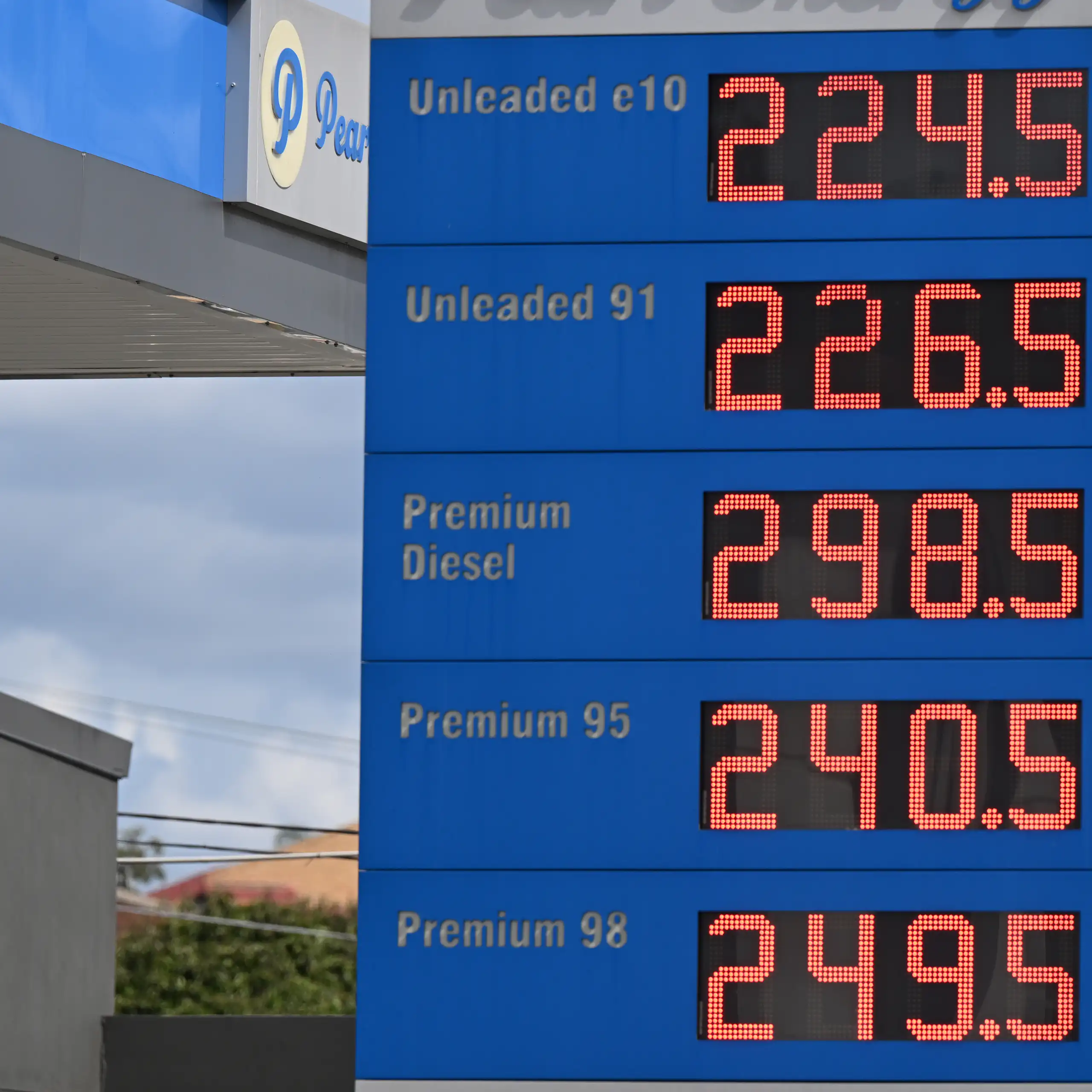 Signage showing fuel prices at a petrol station in Brisbane