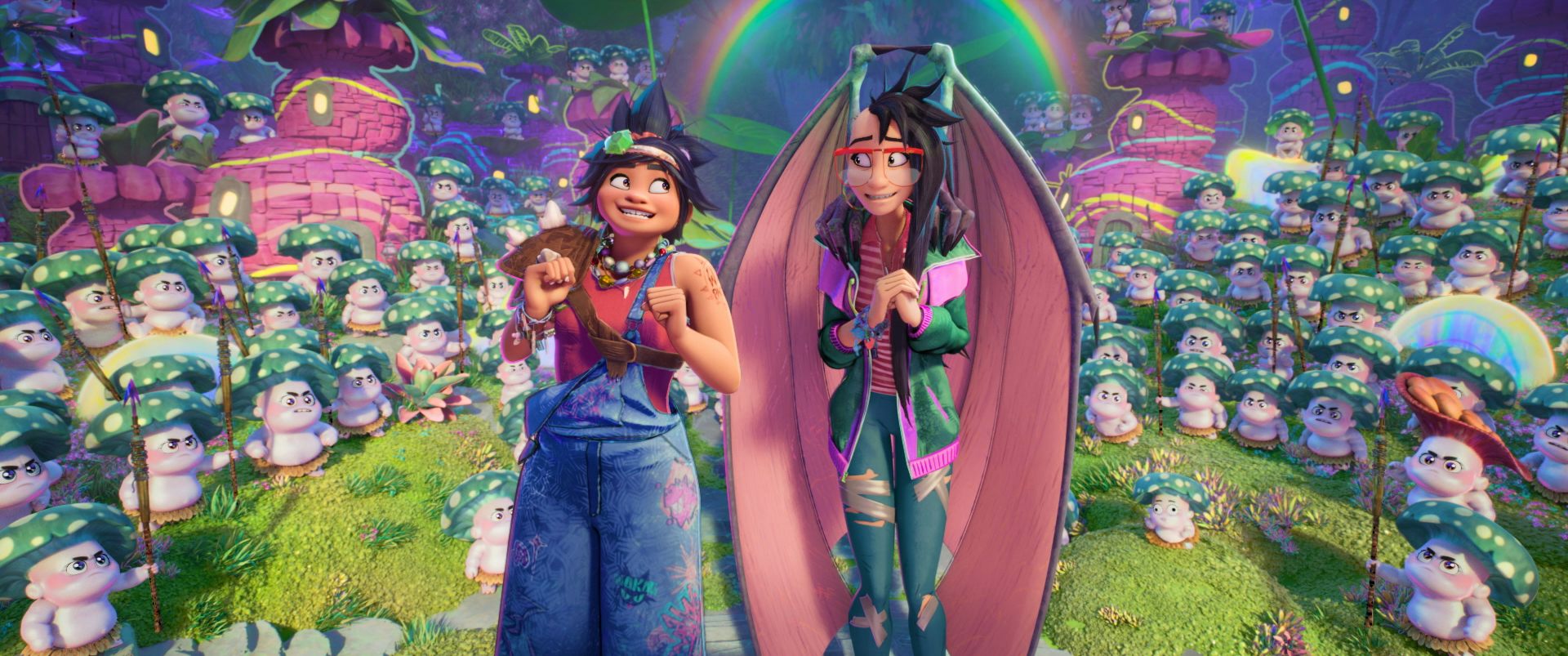 Two young women stand in a clearing with fantastic creatures surrounding them.